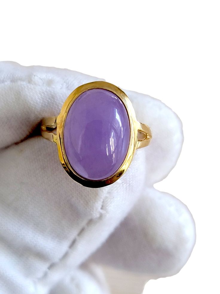 "'The Qīng Purple Jade Ring' represents Royalty. The Chinese character for Qing is composed of 'water' (氵) and 'azure' (青) which are associated to the water element in Chinese philosophy.  The water imagery and clean silhouette of the Ring makes a striking impression and enhances the beauty of the jadeite stone in the center. Crafted in 14K gold, the Qīng Purple Jade Ring is handset with a handpicked Purple Jade gemstone. Ring Sizes Available. Matching Qīng Purple Jade earrings and pendants are Elegant Untreated Gemstones For Anniversary, Yellow Gold Cabochon Amethyst Ring Gift, Timeless Polished Amethyst Ring For Gift, Timeless Amethyst Ring With Polished Finish, Timeless Amethyst Ring With Polished Finish As Gift, Chinese Philosophy, Resin Jewelry Diy, Purple Jade, Jade Gemstone