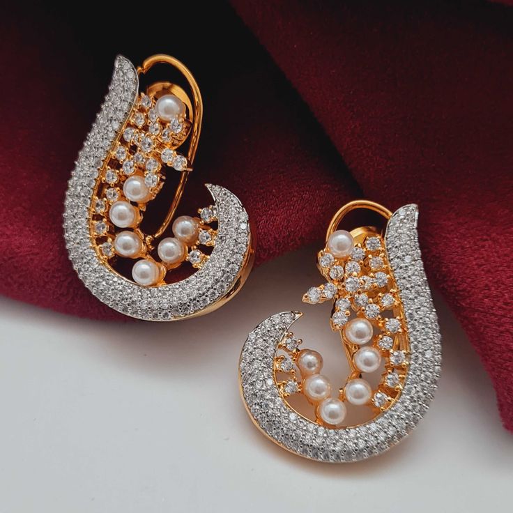 Experience the perfect combination of timeless elegance and modern sophistication with our Veda AD Earrings from the Royal Heritage Collection. Meticulously crafted in the USA and intricately detailed in India, this piece embodies opulence and grace, making it a must-have in our luxurious collection. Its lightweight and versatile design adds a touch of regal allure to any ensemble, elevating your style and completing the regal line. Handcrafted Metal: Metal Alloy, Gold Plated Stone: American Dia Ad Earrings, Hand Harness, Bangle Ring, Kundan Earrings, Foot Jewelry, Heritage Collection, Bangle Set, Wedding Bridesmaids, Necklace Set