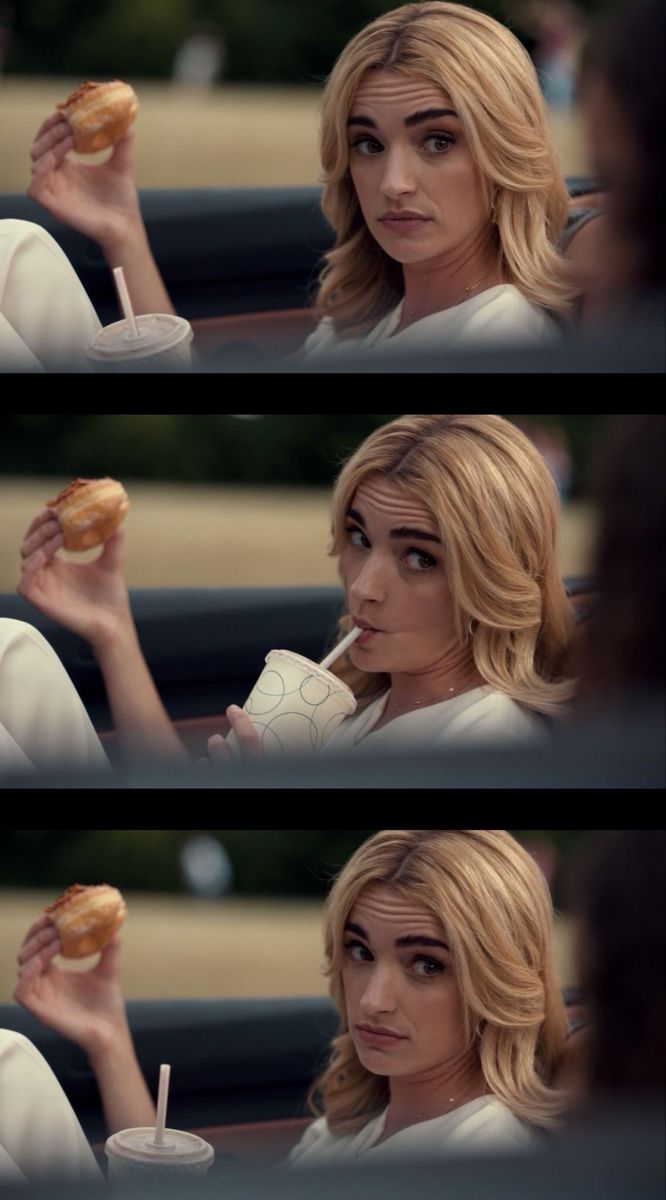 a woman sitting in a car holding a donut