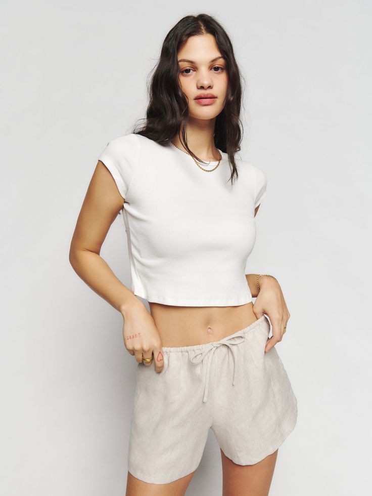 No nonsense. The Zoey is a high rise short with an adjustable, drawstring waist and side pockets. It's relaxed fitting throughout for some extra comfort. This shortrunsbig. For best fit, we recommend sizing down. Casual Cropped Bottoms For Everyday, Sporty Cropped Bottoms For Summer, Relaxed Fit Athleisure Shorts For Day Out, Casual Tops With Elastic Waistband And Short Length, Everyday Drawstring Shorts, Everyday Relaxed Fit Short Length Tops, Casual Everyday Shorts With Drawstring, Everyday Relaxed Fit Short Tops, Casual Cropped Cotton Shorts