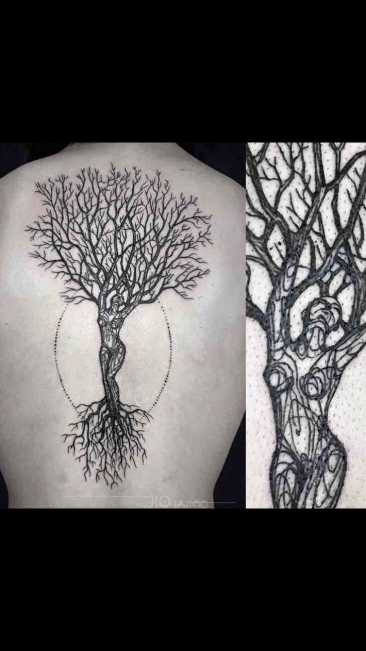 the back of a woman's shoulder with tree tattoos on it