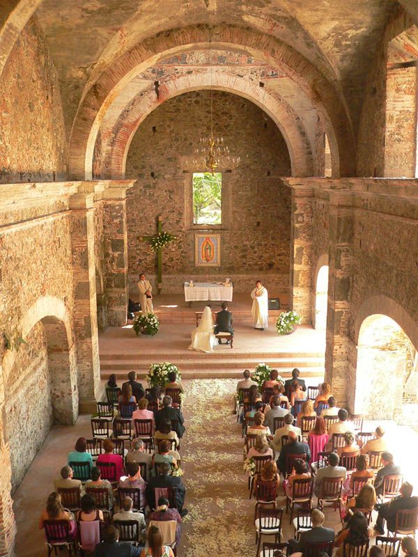 an overhead view of a church with people sitting in chairs and one person standing at the alter