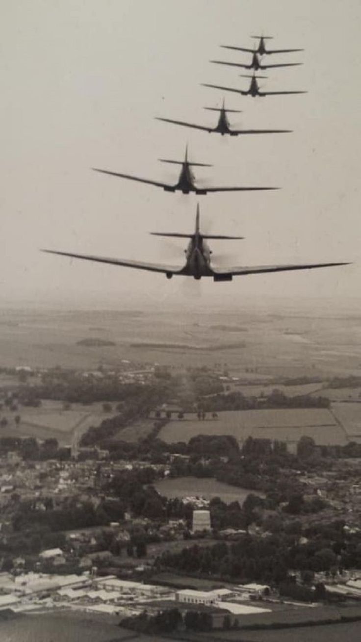 six planes are flying in formation over the city