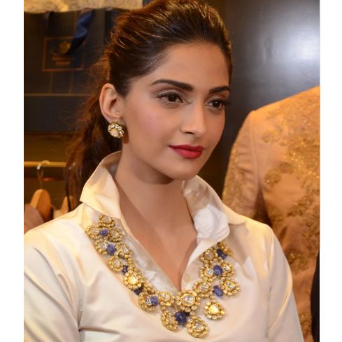 Reinvent radiance with Sonam Kapoor's beautiful polki mala - curated especially for your timeless elegance! Beautiful mala demonstrating a play of fine kundan stones and beautiful beads that came together for the win. Kindly note that earrings are not included in the look. Gold-plated on high-quality brass as base metal. Made by order. Kindly allow 5-7 weeks for the delivery of this item. For custom or urgent requests, please contact support@alacouture.com. *Please Note: We use faux stones and b Elegant Jeweled Kundan Necklace For Festive Season, Luxury Jeweled Bridal Necklace In Temple Jewelry Style, Elegant Chandbali Kundan Necklace, Elegant Chandbali Kundan Necklace With Jewels, Elegant Jeweled Kundan Chandbali Necklace, Elegant Jeweled Kundan Necklace For Diwali, Formal Temple Jewelry Kundan Necklace, Jeweled Bridal Necklace For Celebration, Bollywood Kundan Necklace