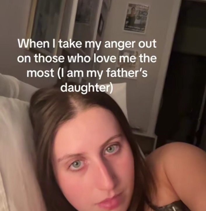 a woman laying in bed with the caption when i take my anger out on those who love me the most i am my father's daughter