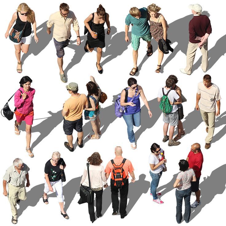 a group of people walking down a street next to each other in the same direction