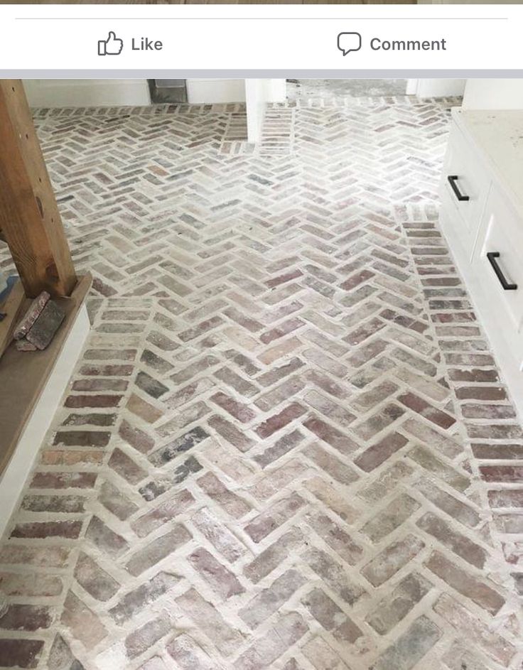 an image of a brick floor that is being used as a bathroom vanity area in a house