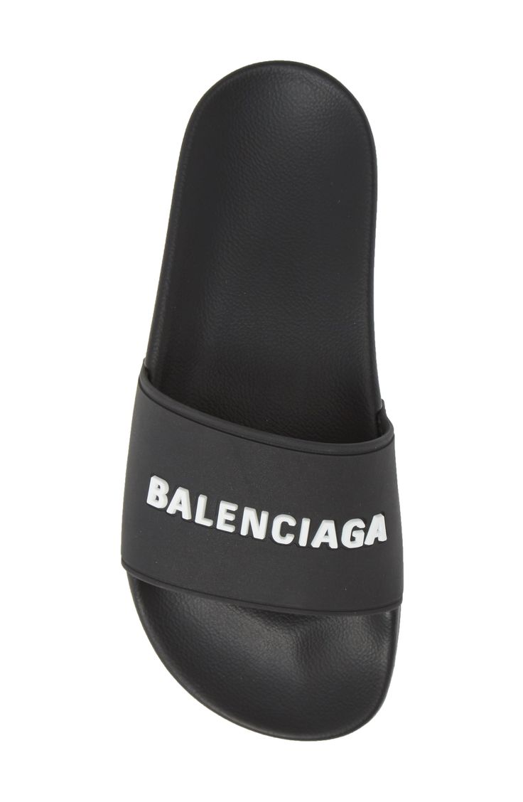 Welded logotype pops in texture and dimension from the bridge of an inky black sport slide molded with a contoured, comfortable footbed. Style Name:Balenciaga Logo Sport Slide (Women). Style Number: 5793907. Available in stores. Balenciaga Slides, Salon Shoes, Pool Sandals, White Balenciaga, Logo Sport, Balenciaga Women, Balenciaga Logo, Balenciaga Black, Slides Women