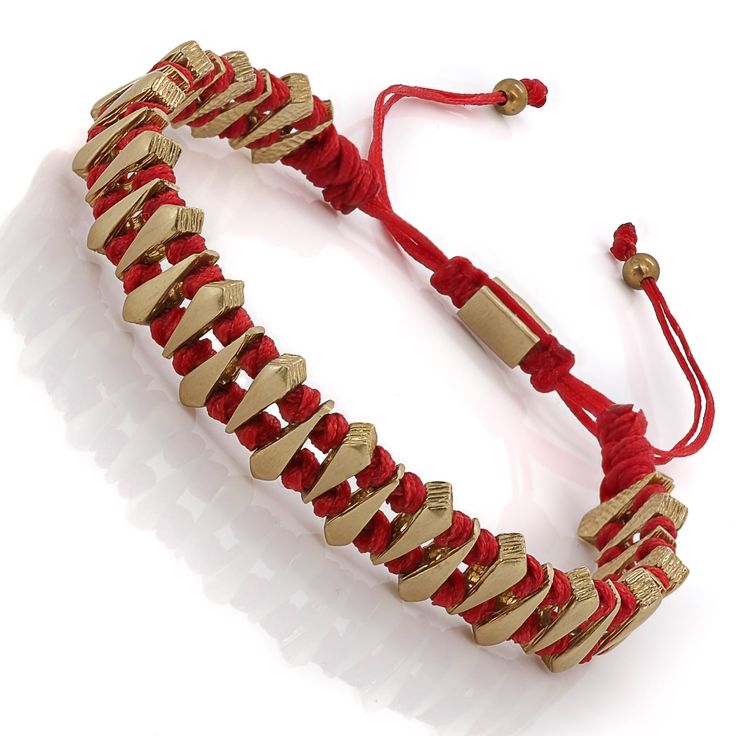 The Fortune Red Woven Unisex Bracelet is a symbol of timeless style, unisex elegance, and the vibrant hues of luck and prosperity. The bracelet features an adjustable design, ensuring a perfect fit for any wrist. Crafted from 24K gold plated brass, the accents gleam with a radiant aura that complements the bracelet's rich red tones.  The deep red shade symbolizes fortune, passion, and vitality, making it an expression of positive energy and endless possibilities. Whether you wear it to embrace c Red Bracelet With Adjustable Chain As Gift, Red Bracelet With Adjustable Chain For Gift, Luxury Red Beaded Bracelets, Elegant Red Bracelets For Good Luck, Elegant Red Adjustable Braided Bracelets, Elegant Red Adjustable Braided Bracelet, Luxury Red Beaded Bracelets As Gift, Luxury Red Beaded Bracelets For Gift, Luxury Red Beaded Bracelet For Gift