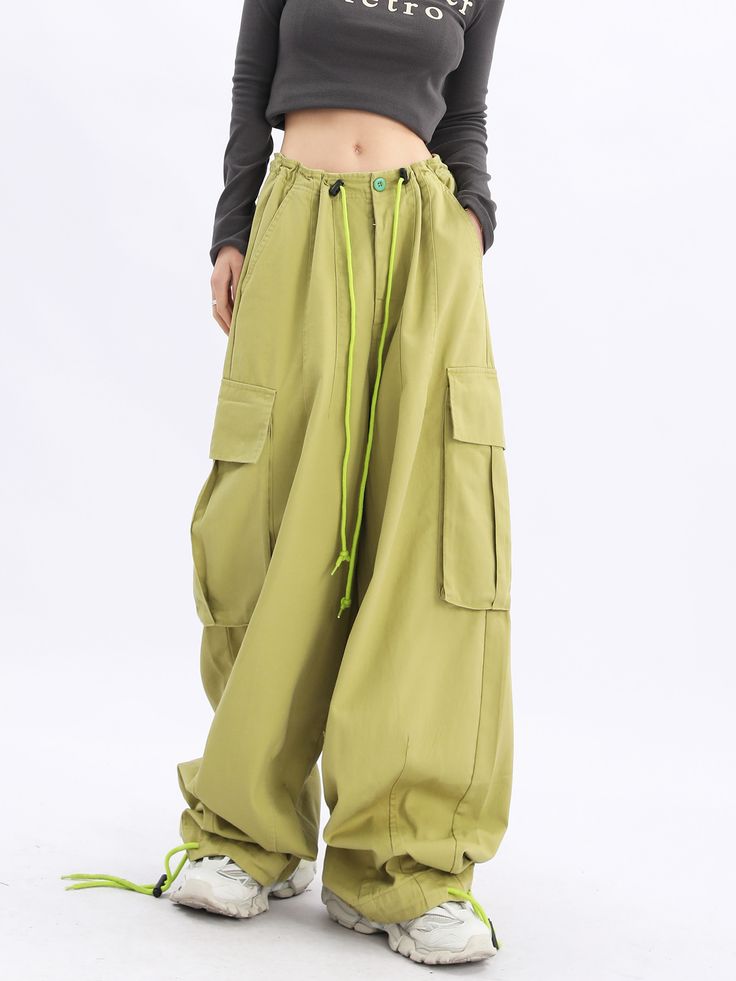 Make a statement with our Acubi Wide Leg Baggy Cargo Pants. These Y2K streetwear essentials boast a relaxed fit, drawstring waist, and plenty of pockets, offering a perfect fusion of style and urban fashion. Spring Utility Full Length Parachute Pants, Khaki Utility Cargo Jeans With Elastic Waistband, Khaki Sweatpants With Pockets For Streetwear, Baggy Cargo Pants With Cargo Pockets, Baggy Casual Cargo Pants With Pockets, Hip Hop Style Wide Leg Bottoms With Pockets, Hip Hop Wide Leg Bottoms With Pockets, Relaxed Fit Cargo Trousers With Multiple Pockets, Streetwear Full Length Harem Pants With Cargo Pockets