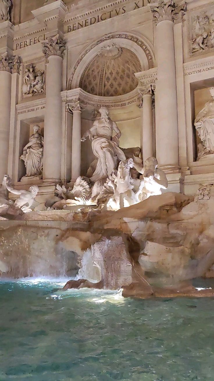 the trellotto fountain is surrounded by statues and water fountains in front of it