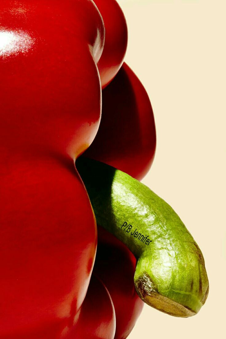 an image of a green apple and red peppers