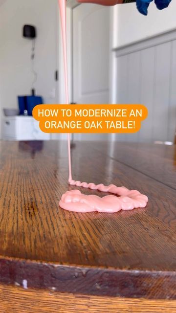 an orange oak table with a sign saying how to modernize an orange oak table