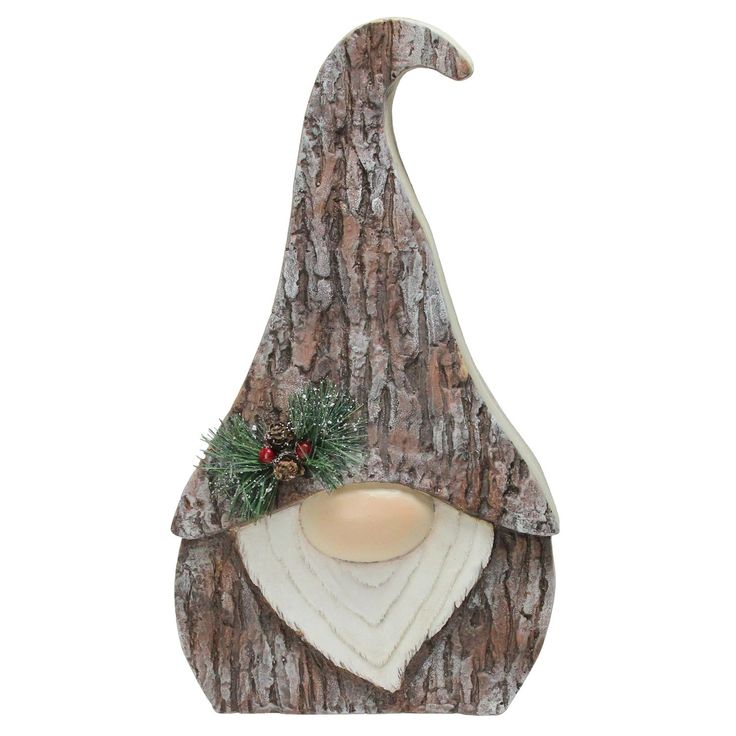 a christmas decoration on the side of a tree with a light in it's mouth