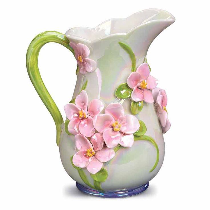 a white vase with pink flowers painted on it