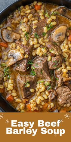 beef barley soup with carrots and mushrooms in a cast iron skillet