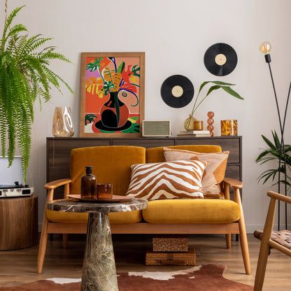 a living room filled with furniture and plants