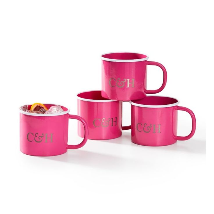 four pink coffee mugs with the words c & g on them, all stacked together