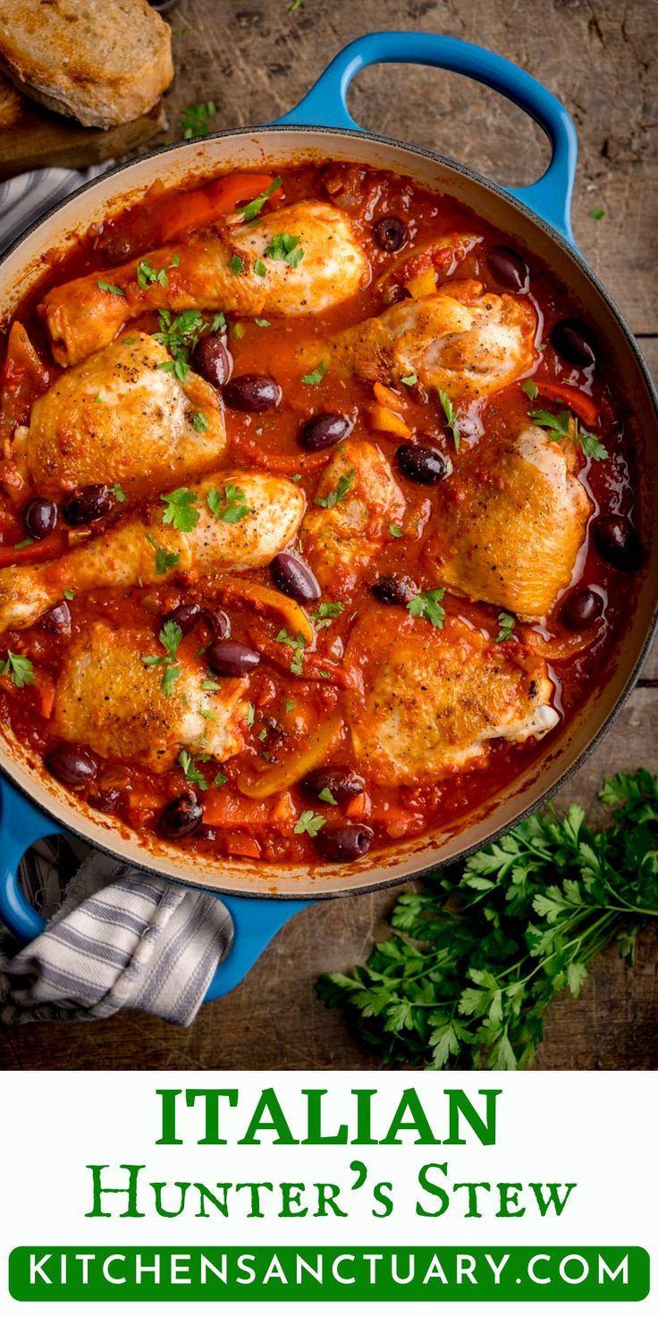 an italian chicken stew in a blue skillet with bread and parsley on the side