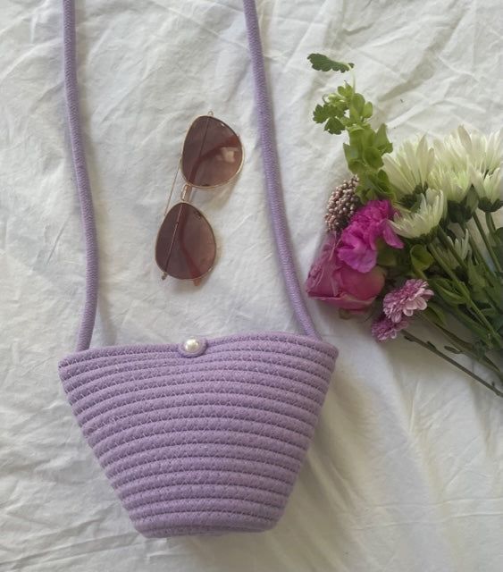 Crossbody Bag 100% Paper Rope Faux Pearl Button Handmade/Imported Color: Purple Approx. Measurements: 4x3x6 inches Trendy Lavender Bag With Adjustable Strap, Lavender Crossbody Shoulder Bag For Everyday, Casual Purple Shoulder Bag With Phone Pocket, Lavender Rectangular Shoulder Bag With Adjustable Strap, Trendy Purple Bucket Bag, Casual Purple Crossbody Bag, Purple Pouch Bucket Bag For Everyday Use, Purple Bucket Bag With Adjustable Strap, Casual Purple Crossbody Shoulder Bag