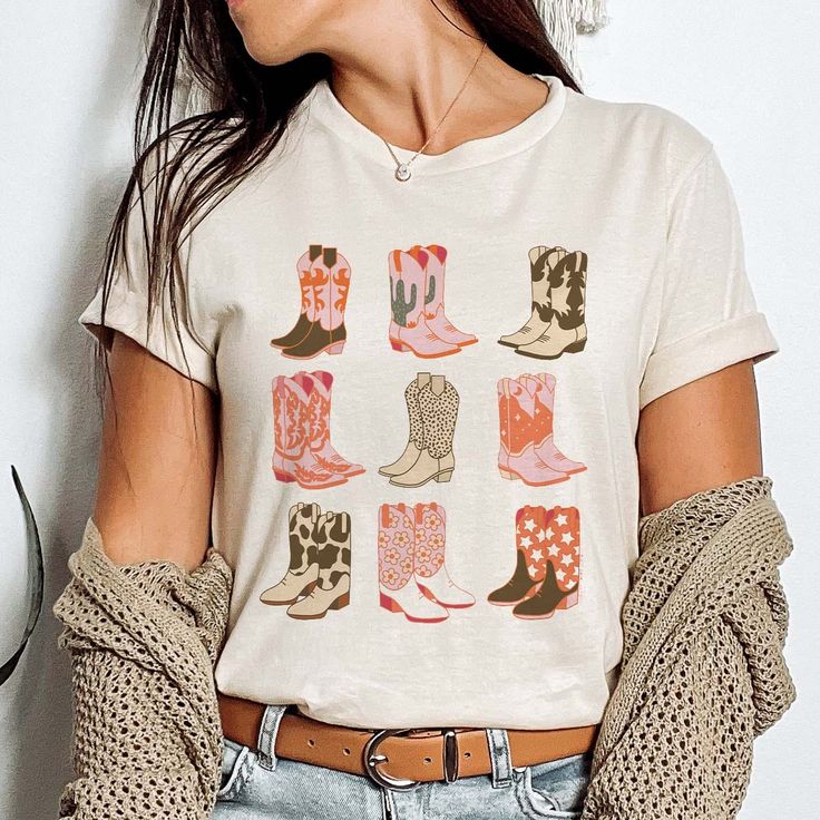 Patterned Cowgirl Boots Design Available In Cream or White Graphic Tee Super Soft & Stretchy Cotton Tee Unisex Cut ~ Runs Roomy ~ If You Want A More Fitted Tee We Recommend You Size Down Women's Sizing Recommendations Small 0/2/4 Medium 4/6/8 Large 8/10/12 XLarge 12/14/16 2XLarge 16/18/20 3XLarge 20/22/24 ***These Are PRINTED/MADE TO ORDER! Please Allow 7-10 Business Days To Ship. If You Order Multiple Items, These Will Be Shipping Out SEPARATELY From Your Order. Western T Shirt Designs, Cowboy Boots Print, Black Cactus, Rodeo Chic, Boots Print, Boots Design, Cowboy Print, Sophisticated Casual, Steer Head