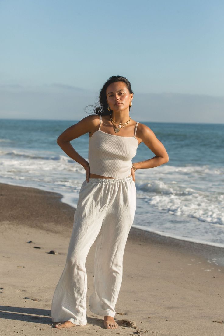 This Sunny Day Ribbed Knit Tank offers a thick ribbed knit fabric and square neck line. Its adjustable straps provide a customizable fit. Stay cool and stylish on warm days with this elevated tank. Casual Everyday Camisole With Square Neck, Casual Square Neck Camisole For Everyday, Summer Everyday Ribbed Bottoms, Ribbed Bottoms For Everyday Summer Wear, Casual Square Neck Camisole, Ribbed Tank Top For The Beach, Casual Square Neck Tank Top For Beach, Ribbed Tank Top For Beach, Chic Ribbed Tank Top For Beach