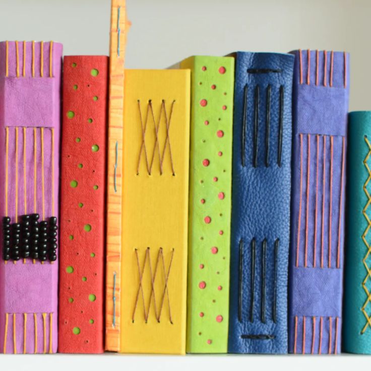 a row of colorful books sitting on top of each other