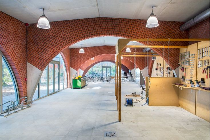 the inside of a brick building with lots of windows