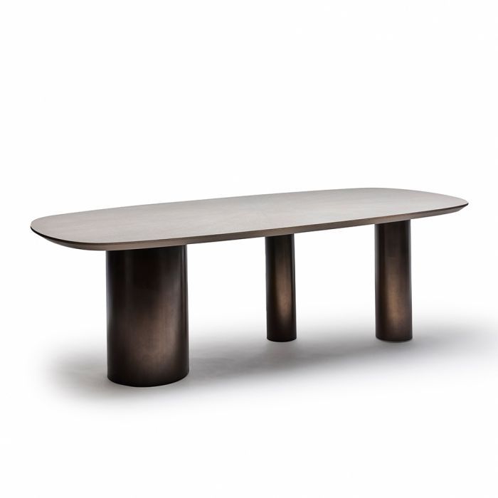 an oval dining table with two black legs