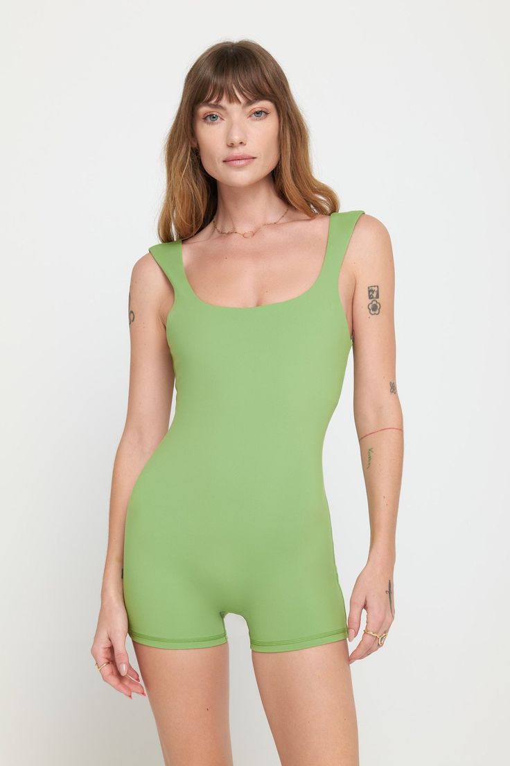 Short but sweet. A short-length bodysuit with a double-layer fabric at the chest, wide to narrow tapered straps, and a front and back scoop neckline. Made in our 4-way stretch Dream Tech eco-conscious fabrication that is compressive, moisture-wicking, quick-drying, and anti-odor. | Salem Shorts Bodysuit in Cactus Green Elastane Bodysuit For Spring, Summer Bodysuit With Built-in Bra And Wide Straps, Spring Green Elastane Bodysuit, Green Sleeveless Seamless Bodysuit, Green Seamless Sleeveless Bodysuit, Green Sleeveless Bodysuit With Built-in Bra, Seamless Green Bodysuit For Spring, Fitted Green Bodysuit With Scoop Neck, Green Fitted Bodysuit With Adjustable Straps