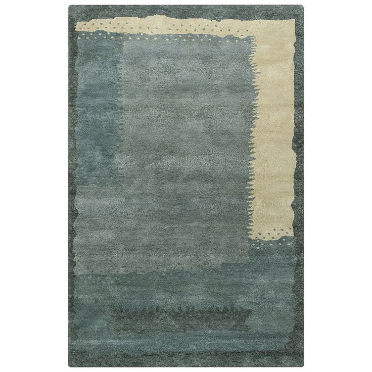 an area rug with blue, beige and green colors on the bottom half of it