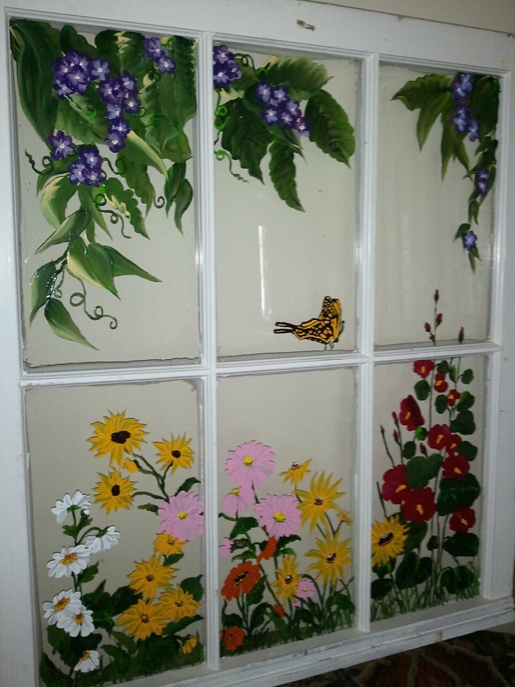 a window with flowers painted on it