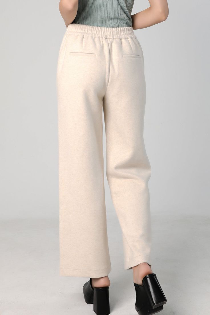 Stay Comfortable and Stylish with our Straight Leg Sweatpants Perfect for living in, these cozy sweatpants are also stylish. They're warm enough to be worn out in cool weather. The raw cut side seam elongates your legs. Features a wide waist band with drawstring and side pockets. Style #: WWSI901 Winter Full-length Pants With Ribbed Waistband, Chic Full-length Sweatpants For Fall, Cozy Winter Pants With Ribbed Cuffs, Chic Full-length Fall Sweatpants, Solid Soft Sweatpants For Fall, Full-length Sweatpants With Ribbed Cuffs For Fall, Full Length Sweatpants With Ribbed Cuffs For Fall, Soft Texture Sweatpants For Fall, Winter Full Length Loungewear Bottoms