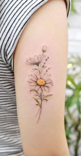 a woman's arm with a flower tattoo on the left side of her body