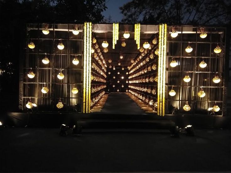 an entrance to a building with lots of lights on the outside and in the inside