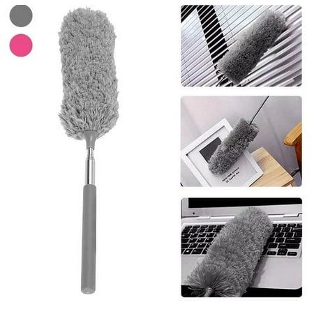 an image of a cleaning brush that is on top of a laptop computer and in the process of being cleaned