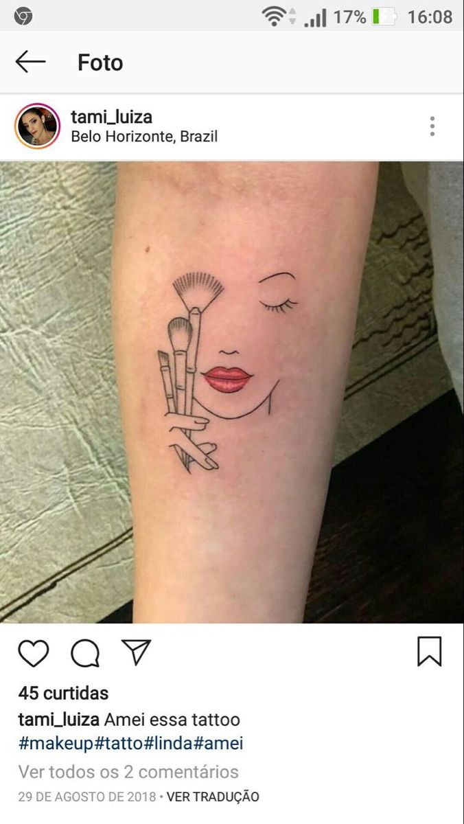 a woman's face with makeup brushes on her arm