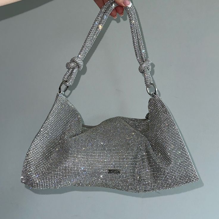 Used Cult Gaia Shoulder Bag Wear Shown On Interior, See Images No Odor Zipper Runs Smooth Some Stones Missing Flat 14.5”W X 7.5”H Open To Offers 90s Aesthetic Holidays Sparkle Y2k Shoulder Bag Evening Bag Formal Bag Party Shoulder Bucket Bag With Handles, Silver Clutch Shoulder Bag With Dust Bag Included, Handheld Baguette Bag With Removable Pouch For Party, Handheld Bucket Bag With Top Carry Handle For Party, Evening Pouch Baguette Bag With Top Carry Handle, Silver Clutch Shoulder Bag With Dust Bag, Chic Silver Tote Evening Bag, Elegant Silver Bucket Bag For Shopping, Luxury Bucket Bag With Top Carry Handle For Party