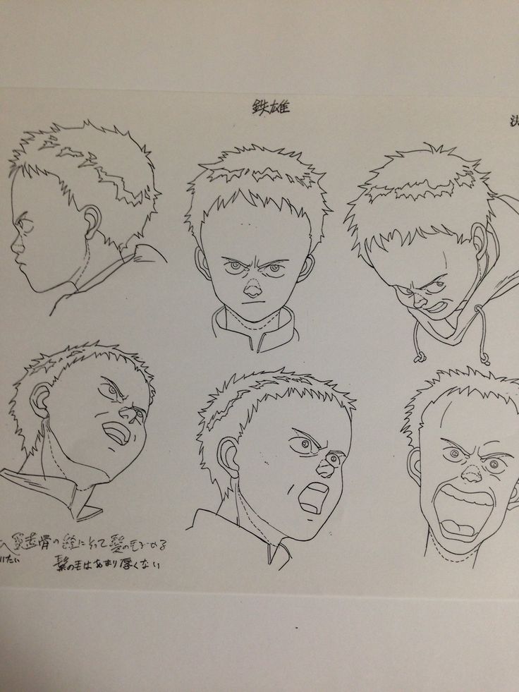 a drawing of various facial expressions on a piece of paper