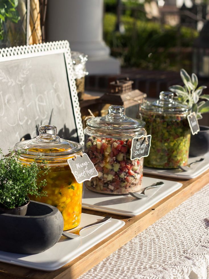 jars filled with food sitting on top of a table