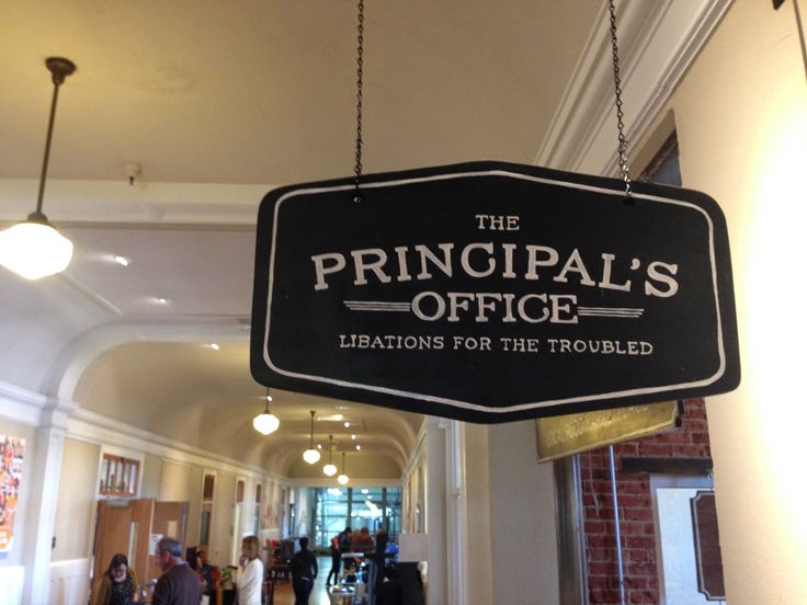 the principals office sign hangs from the ceiling