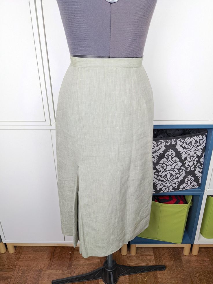 "Vintage 70's linen suiting skirt. Lovely shape, lightweight and breathable. Perfect for looking professional or dressed up in warm weather. Good condition, any flaws shown in pics. Matching blazer shown in pics is available in a separate listing. Marked a size 6, runs a little small. Best fits a size 4 but please check measurements below. Waist: 25\" Hip: 35\" Length: 28\"" Formal Linen Skirt For Spring, Formal Spring Linen Skirt, Fitted Linen Knee-length Bottoms, Fitted Knee-length Linen Bottoms, Fitted Linen Formal Skirt, Formal Fitted Linen Skirt, Fitted Linen Skirt For Formal Occasions, Fitted Linen Pencil Skirt, Tailored Summer Skirt Suit For Workwear