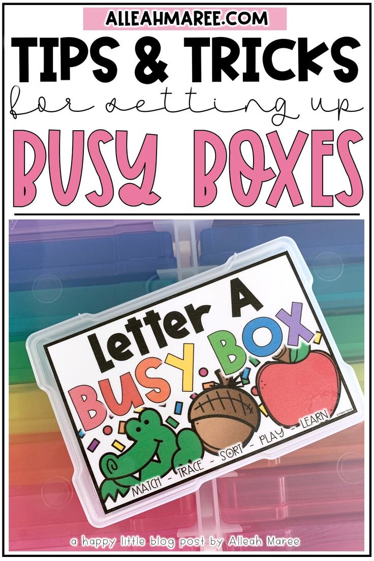 a close up of a sign with the words busy boxes on it and an apple