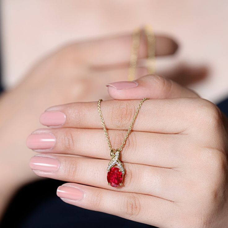 Product Details Introducing a one-of-a-kind Created Ruby Pendant Necklace that is both delicate and charming. The 8X10 MM Oval Cut Created Ruby takes center stage in a 4 Prong Setting, with a Twisted Bail adorned with Diamond on a Solitaire Pendant. This Designer Pendant is so beautiful that its likely to become a staple in your collection, one youll never want to take off. Product Information SKU SHP-PENDANT032215345 Weight 3.60 gm (Approximate) LAB CREATED RUBY INFORMATION No.of Stones 1 Pieces Total Weight 4.00 Carat (Approximate) Dimension(approx) Oval-8X10 mm-1 Pcs Color Red Cut Brilliant Shape Oval Setting Type 4-Prong-Setting Quality Grade AAAA DIAMOND INFORMATION No.of Stones 17 Pieces Total Weight 0.17 Carat (Approximate) Dimension(approx) Round-1.10X1.10 mm-16 PcsRound-1X1 mm-1 P Ruby Pendant Necklace, Galaxy Stuff, Mangal Sutra, Oval Setting, Ruby Necklace Pendant, Diamond Jewelry Set, Solitaire Necklace, Ruby Pendant, Ruby Necklace