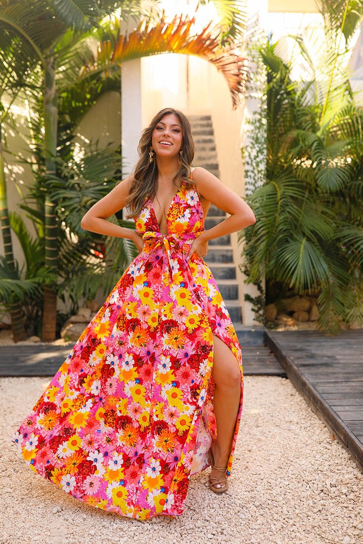 Make sunny days even brighter in the Zena Maxi Dress! This flowy, floral number can take you from a day at the beach to a night on the town—just adjust the straps, tie the keyhole, and you’re ready to go! Plus, you’ll look fabulous thanks to its plunging V, side slit, and elastic back. Shine on! Product Details: Fit: The Zena Dress fits true to size. Length: Maxi length and the small measures to be 42.5" from shoulder to hem. Bust: Fitted. Waist: Relaxed fit. Fabric: Fabric contains no stretch. Getaway Dress, Raspberry Rose, Womens Boho Dresses, Heading Fonts, Apple Coloring, Plunging Neck, Pink Summer, Shine On, Clothing Labels