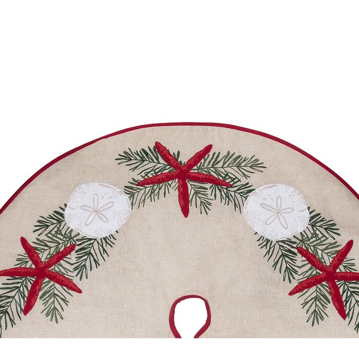 an embroidered christmas wreath with red bows and starfishs on the bottom is shown