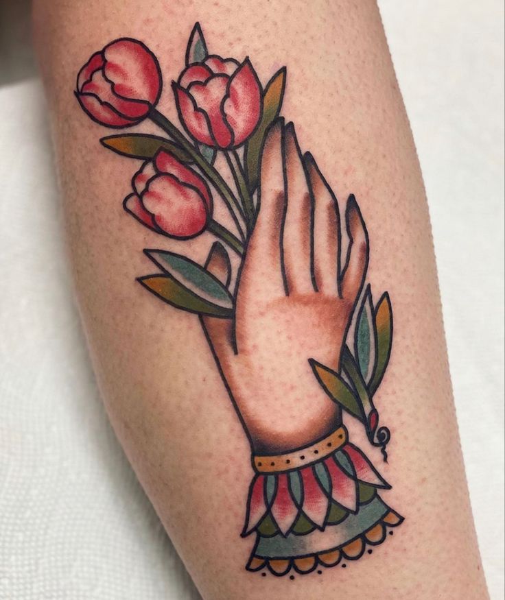 a close up of a person's arm with flowers on it