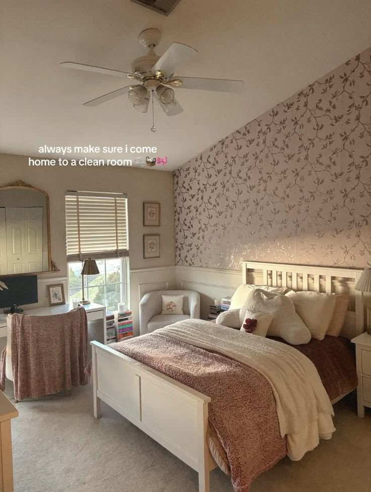 a bed room with a neatly made bed next to a window and a ceiling fan