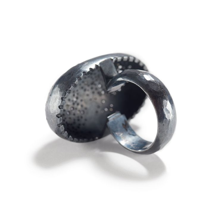 Oxidized sterling silver, diamond meleeThis striking pebble domed ring features a smattering of diamond melee, delicately placed and set along a perforated dome, with a coined edge on the bottom where the rounded ring band meets the form. Admiring the dazzling scene before you, one could determine Sandra Enterline's composition as a intricate, detailed intergalactic scene where stars, asteroids and meteors, all float by and by in infinite space. Or an abstract piece that lovingly devotes attenti Round Rings, Domed Ring, Oxidized Sterling Silver, Band Rings, Silver Rings, Band, Sterling Silver, Silver