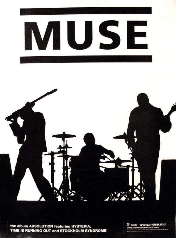 the silhouettes of three men playing instruments on stage